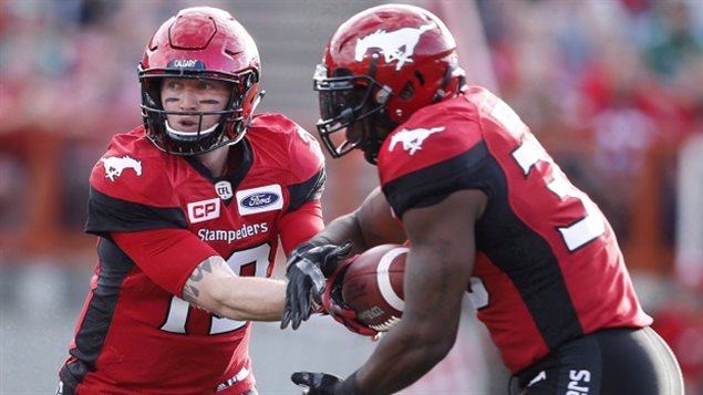 With quarterback Bo Levi Mitchell, left, and running back Jerome Messam, Calgary can attack by air or by land. (Larry MacDougal/Canadian Pres