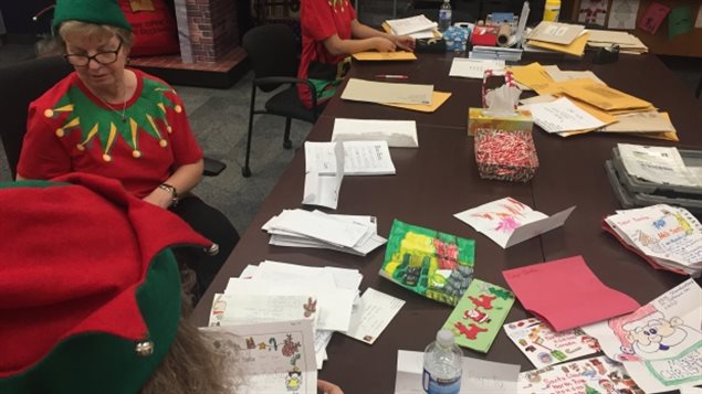 : Santa’s elves usually spend about four weeks helping sort through the letters.