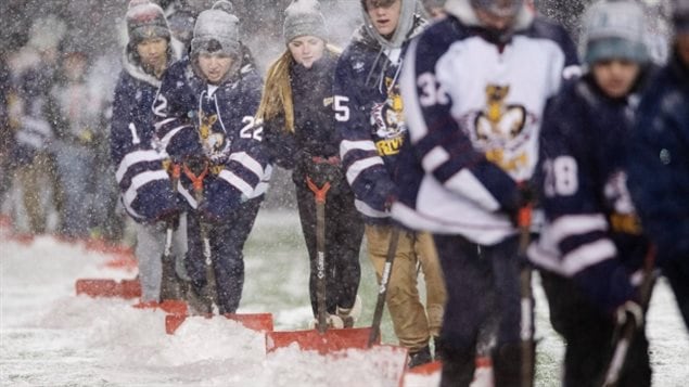 It’s a Canadian thing. Fans shovel snow from the field before the match at Lansdowne Park’s TD Place before the 105th Grey Cup on Sunday, Nov. 26, 2017 in Ottawa. 