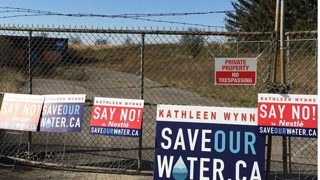 Protest posters on the gates of Nestle’s newly purchased well property 