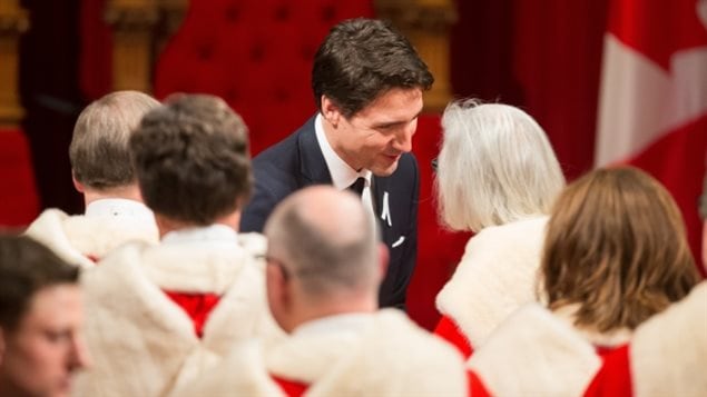 Prime Minister Justin Trudeau speaks with Chief Justice Beverly McLachlin and other justices of the Supreme Court in 2015.