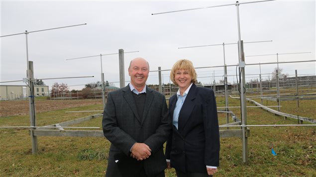 Prof. Wayne and Anna Hocking stand before VHF windprofiler radars they say can help better predict tornadoes.