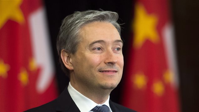 Canadian Minister of International Trade Francois-Philippe Champagne looks on as Prime Minister Justin Trudeau holds a news conference in Beijing, China on Tuesday, Dec. 5, 2017.