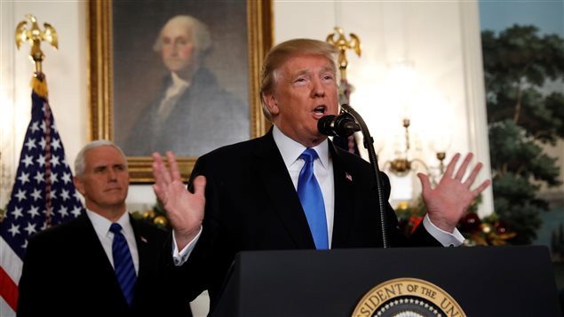 U.S. Vice President Mike Pence listens as U.S. President Donald Trump announces that the United States recognizes Jerusalem as the capital of Israel and will move its embassy there, during an address from the White House in Washington, U.S., December 6, 2017. 