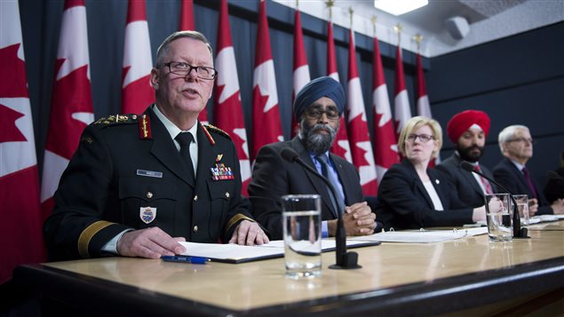 General Jonathan Vance, Chief of the Defence Staff (left to right) Defence Minister Harjit Sajjan, Carla Qualtrough, Minister of Public Services and Procurement, Navdeep Bains, Minister of Innovation, Science and Economic Development and Marc Garneau, Minister of Transport make an announcement on fighter jets at the National Press Theatre in Ottawa on Tuesday, Dec. 12, 2017.