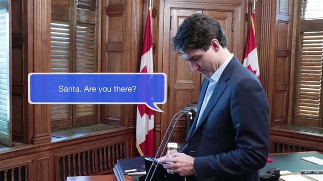 Prime Minister Justin Trudeau appears perplexed when Santa Claus does not reply to his text message.