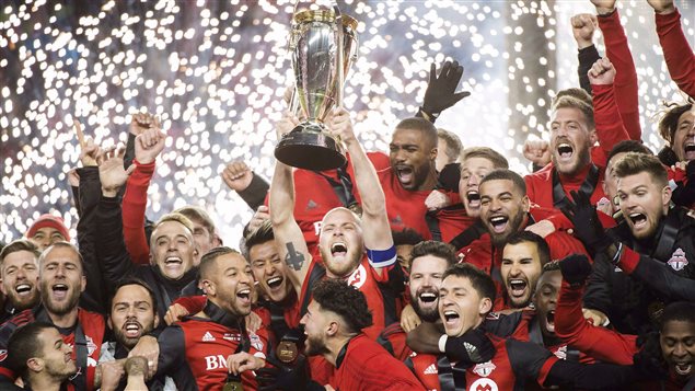Toronto FC midfielder Michael Bradley, centre, hoists the MLS Cup with teammates after defeating the Seattle Sounders during MLS Cup soccer action in Toronto on December 9. Toronto set a Major League Soccer season scoring record with 69 points.