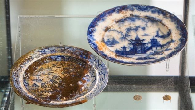 Ceramic plates and tunic buttons recovered from the wreck of HMS Erebus. Scratch marks from cutlery can be seen on some dinner plates, said curator Karen Ryan. 