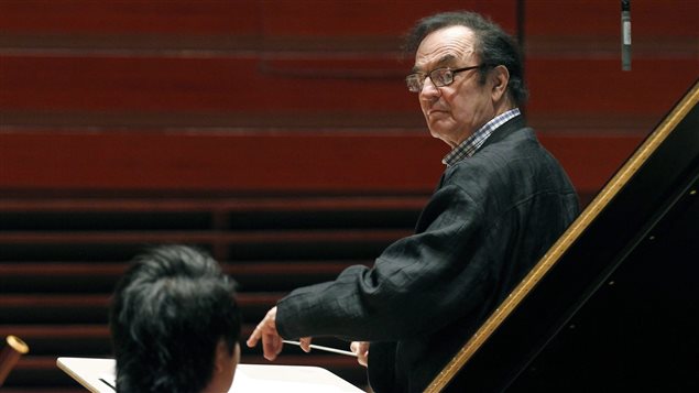 In this Oct. 19, 2011 file photo, world-renowned conductor Charles Dutoit, right, performs with the Philadelphia Orchestra during a rehearsal in Philadelphia. Four women have accused Dutoit of sexual misconduct that allegedly occurred on the sidelines of rehearsals or performances with some of America's great orchestras.