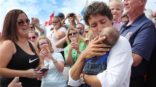 Prime Minister Trudeau interacts with the crowd on the soccer pitch at the Newfoundland and Labrador Summer Games in Conception Bay South, N.L, on August 15, 2016.