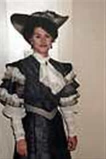 In this 1991 photo provided by Paula Rasmussen, Rasmussen poses while dressed for her part in 