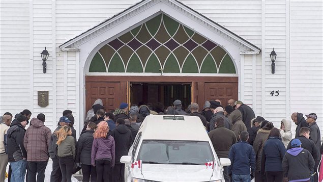 Family and friends arrive at the funeral for Lionel Desmond and his mother Brenda Desmond at St. Peter's Church in Tracadie, N.S. on Jan. 11, 2017. 