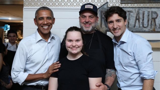 Former U.S. president Barack Obama and Prime Minister Justin Trudeau pose with David McMillan and his daughter Dylan at the Montreal restaurant Liverpool House during a visit by Obama in June.
