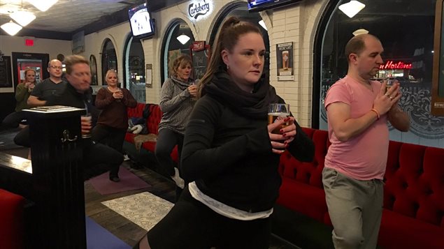 A beer yoga class in a Windsor Ontario pub. Since it came to the city it has become very popular.