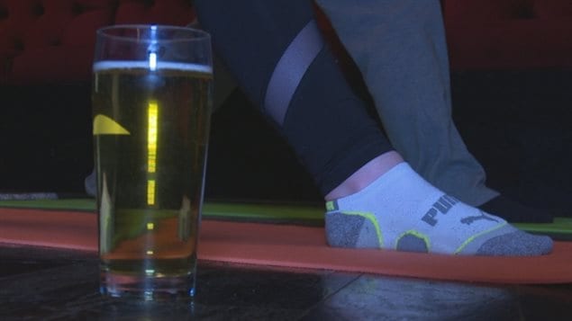 A pint of beer waits by a yoga mat at the Beer-Yoga class in Windsor
