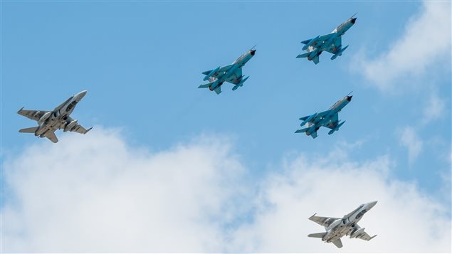 Canadian CF-18’s in formation with Romanian MiG-21’s