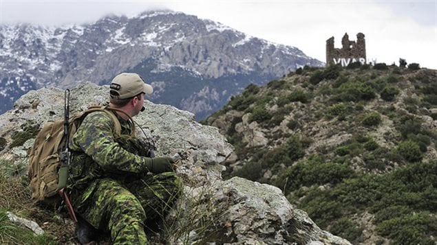 Capt. Andrew Jewer from CFB Valcartier sits at his station and observes other members of the Canadian joint terminal attack controllers during a training mission for SERPENTEX 2013 in Corsica, France on Dec. 2 2013.