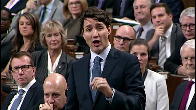 Prime Minister Trudeau under fire in the House of Commons over ethics violations for his vacation on the private island of the Aga Khan and ties to him and his business and charities.