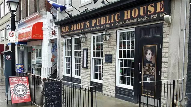 Another view of Sir John’s Public House, the sign was changed on Tuesday, removing reference to Sif John A Macdonald, founder of Canada, and who practised law in this very Kingston, Ontario, building in the mid 1800s