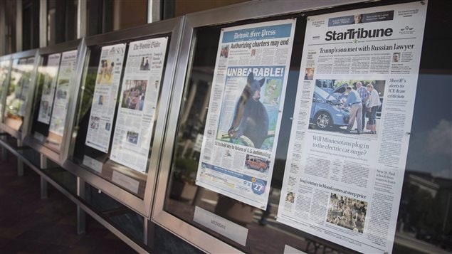 Newspaper front pages are displayed at the Newseum in Washington on July 10, 2017. The U.S. Department of Commerce slapped an overall tariff of 6.53 per cent on about 25 Canadian plants, mostly in Quebec and Ontario, following an investigation that began in August 2017. 
