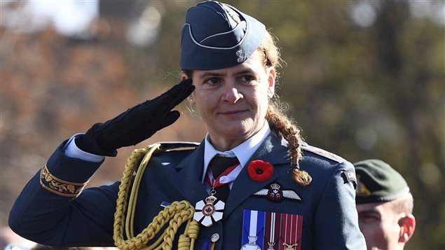 Governor General Julie Payette salutes during the march past during the National Remembrance Day Ceremony at the National War Memorial in Ottawa on Saturday, Nov. 11, 2017. 