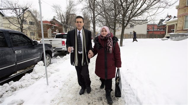 Hassan Diab walks with his wife, Rania Tfaily, following a press conference regarding his return to Canada in Ottawa on Wednesday. 