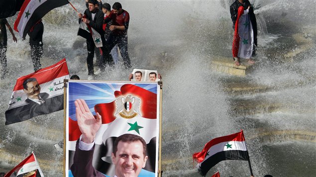 Une manifestation pro-Al Assad dans les rues de Damas le 13 novembre dernier.