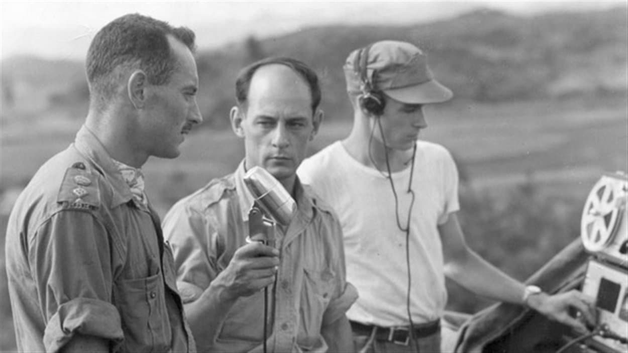 Radio-Canada International journalist Rene Levesque interviews Lt.-Col. Jacques Dextraze in Korea in 1951, while technician Norman Eaves looks on. (National Defence/Radio-Canada/CBC Still Photo Collection)