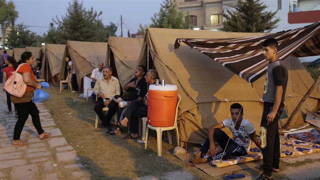 Des membres de la communauté yézidie ont trouvé refuge dans un camp de déplacés à Erbil, dans le nord de l'Irak