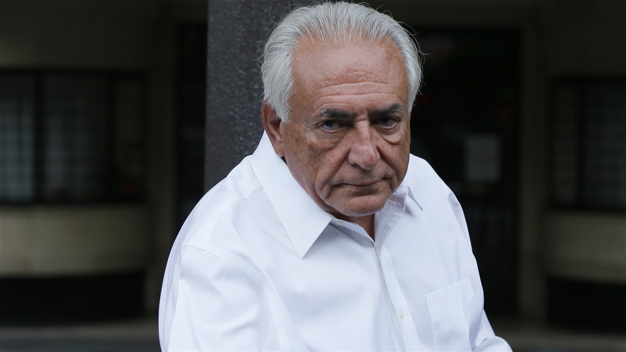 Dominique Strauss-Kahn s'apprête à monter dans sa voiture à Paris pour se rendre à Lille pour entendre le jugement, le 12 juin.