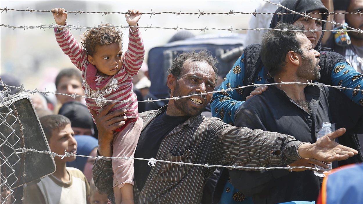 Des réfugiés syriens è la frontière turque