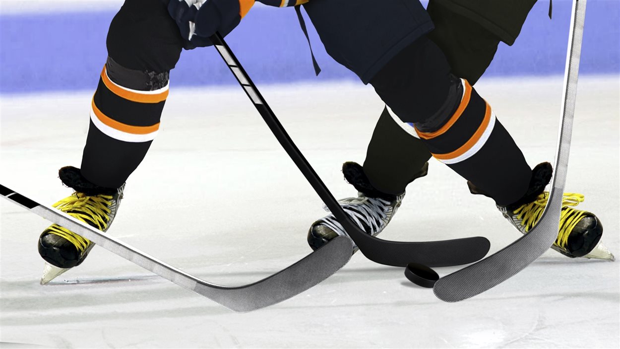 Des joueurs de hockey en action.