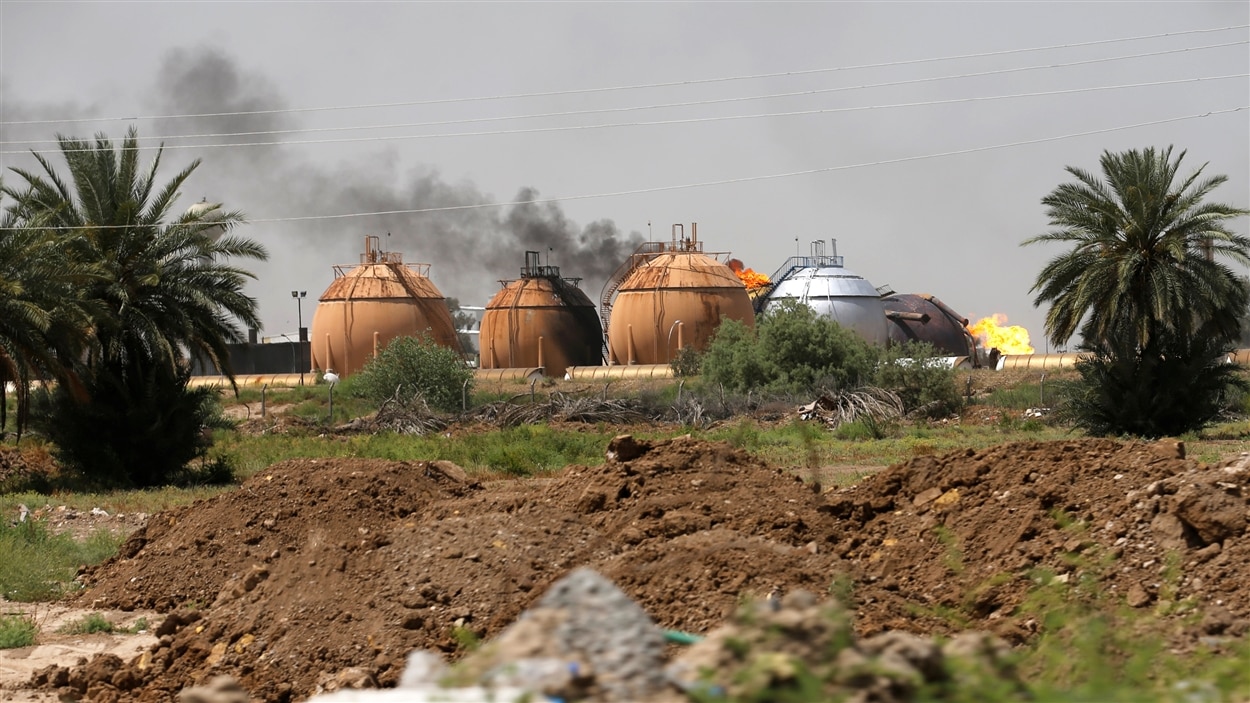 L'usine des faubourgs de Bagdad fabrique du gaz à usage ménager.