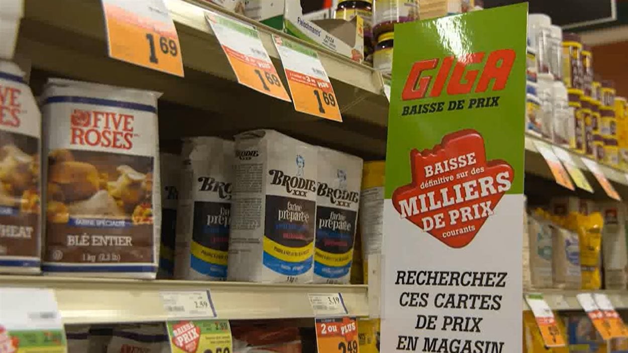 Une pub affichant les baisses de prix chez IGA