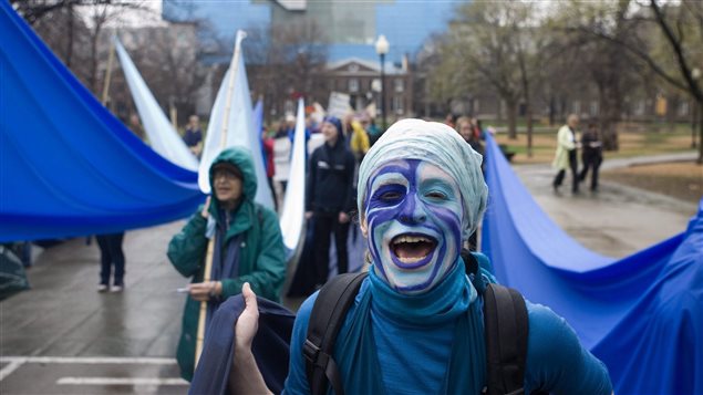 A demonstrator demands restitution for mercury poisoning at a Toronto march on April 7, 2010. The issue is not new.